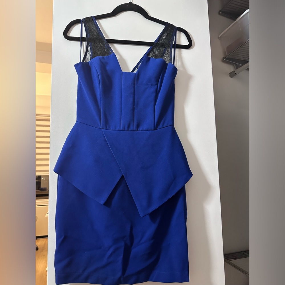 Navy mini peplum dress with black lace shoulders